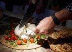 Mozzarella being cut RossoPomodoro