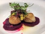 photo of seared scallops on beetroot slices