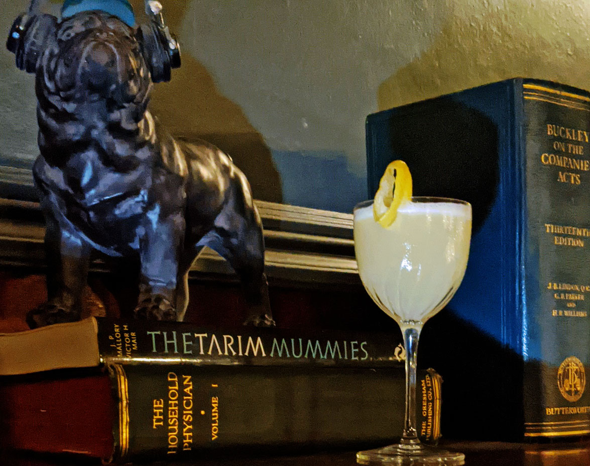 Cocktail and bulldog with cans