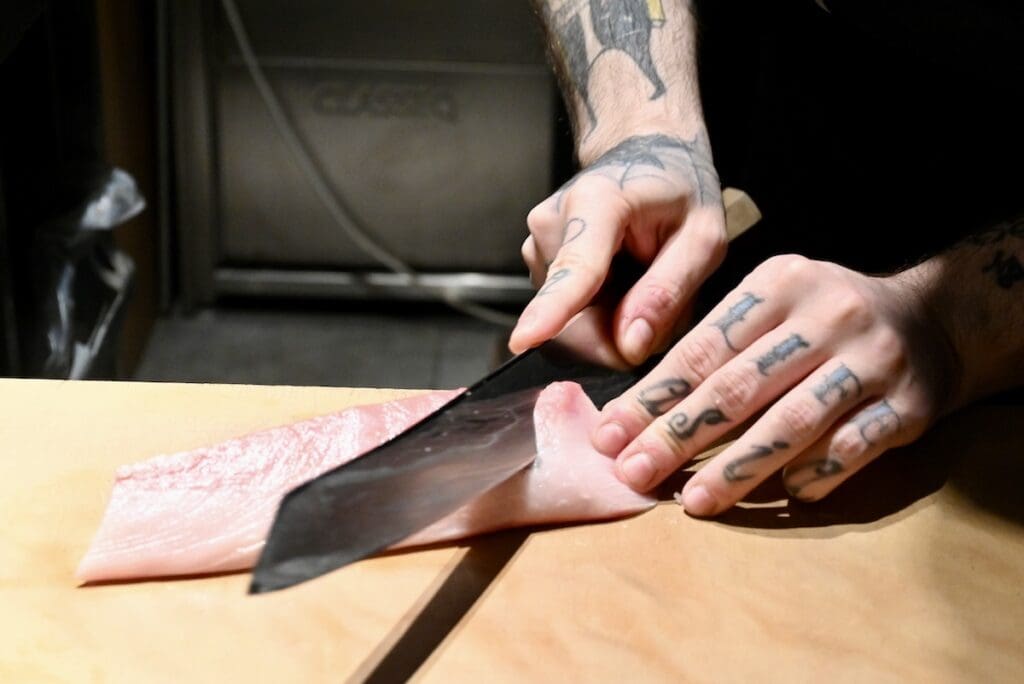 Sushi on Jones slicing fish