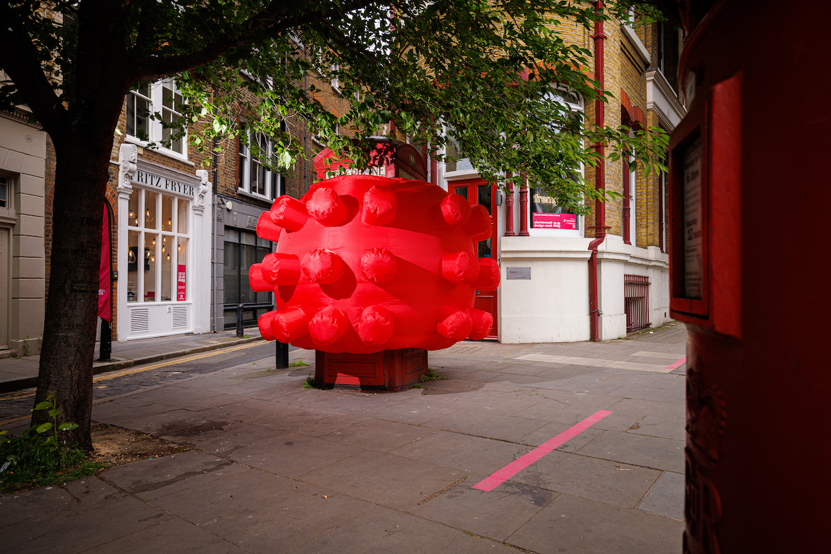 An iconic red phonebox encapsulated by an inflatable red structure much like a virus. Steve Messam’s installation ‘K2’ at Clerkenwell Design Week. Image Sam Frost.