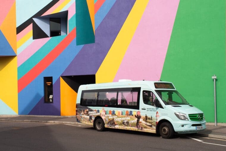 Sussex Art Shuttle outside the brightly coloured facade of the Towner Eastbourne. Credit Thomas Broadhead