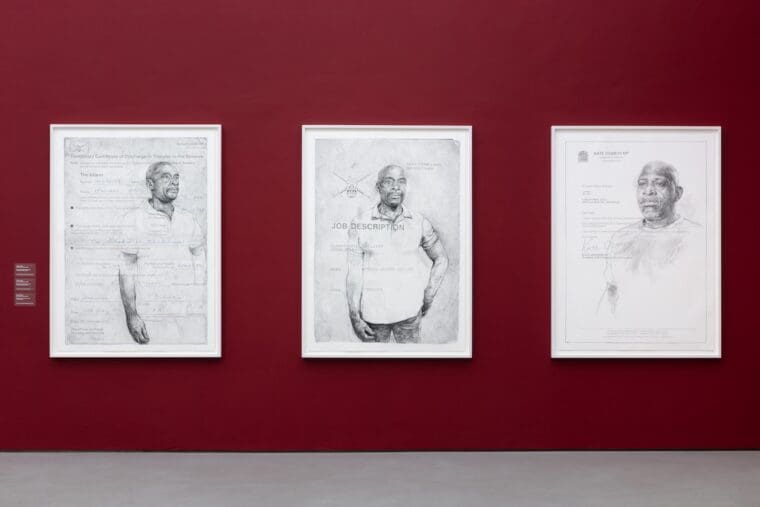 Installation shot of three of Barbara Walker's large scale drawings on a burgundy painted wall. Turner Prize 2023, Towner Eastbourne. Photo Angus Mill