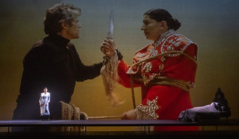 Aigul Akhmetshina (Carmen), Willem Dafoe and Marina Abramović (Maria Callas) in 7 Deaths Of Maria Callas an Opera Project by Marina Abramović with music by Marko Nikodijević @ London Coliseum. Conducted by Yoel Gamzou. Marina Abramović, Director, actor, set designer and scenography (Maria Callas). (Opening Night 03-11-2023) ©Tristram Kenton 10-23 (3 Raveley Street, LONDON NW5 2HX TEL 0207 267 5550 Mob 07973 617 355)email: tristram@tristramkenton.com