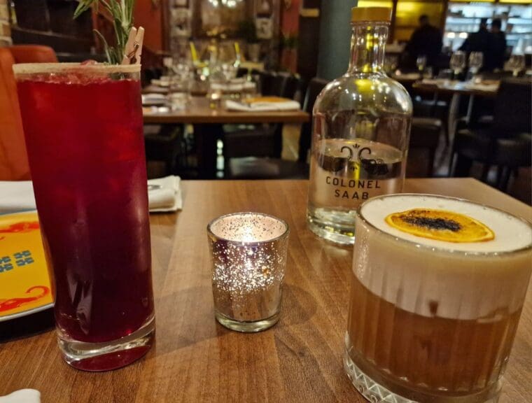 A long beetroot flavoured cocktail and a chai, coffee and whiskey at Colonel Saab Trafalgar Square restaurant 