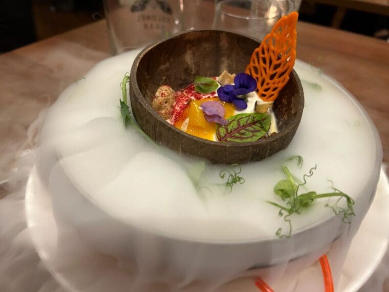 Pannacotta served in a coconut shell at Colonel Saab Trafalgar Square restaurant