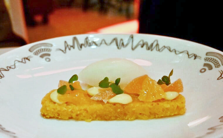 Orange Polenta cake on a plate at Spagnoletti