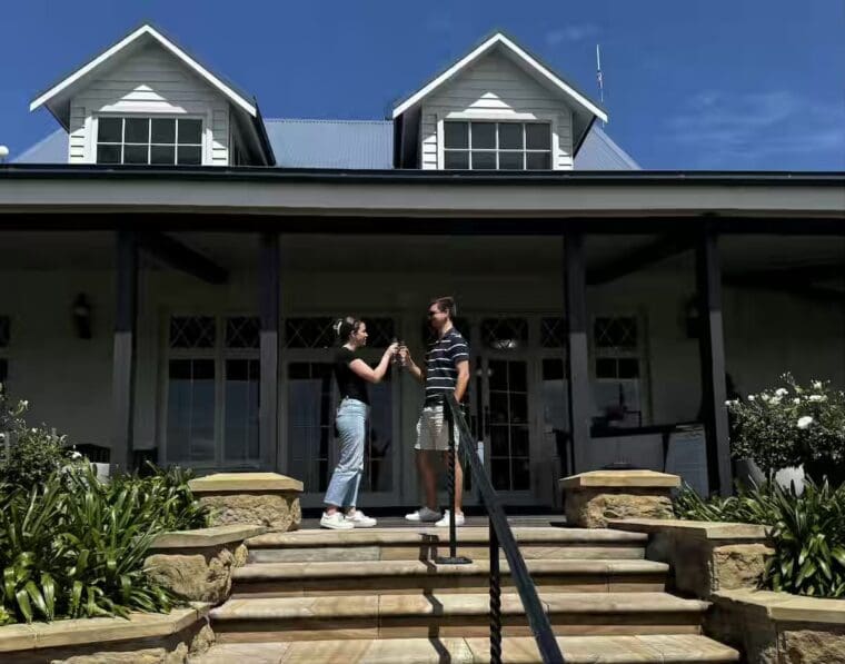 Couple celebrating with a toast at Audrey Wilkinson Winery Hunter Valley