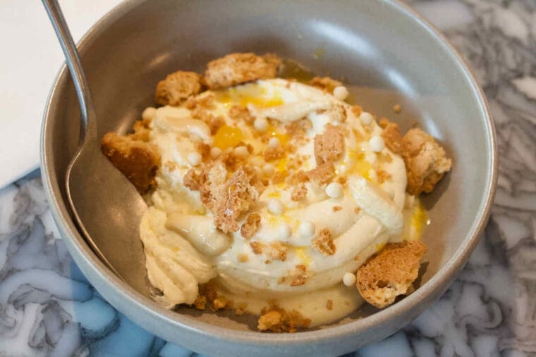 White chocolate cheesecake with crushed amaretti biscuits served at Duvale's Riverside East restaurant in Stratford.