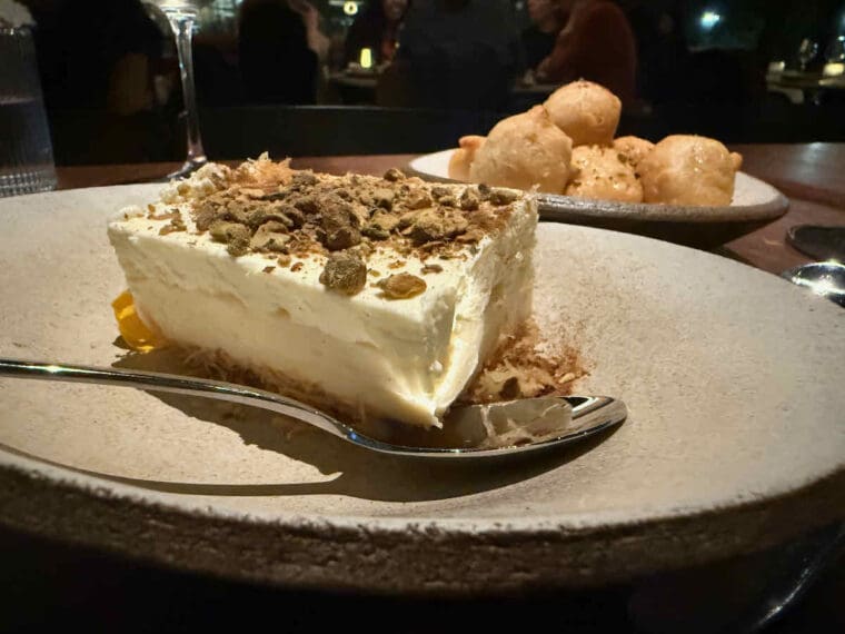 Greek dessert of Ekmek Kataifi Pistachio Cream Custard on a bed of shredded filo pastry