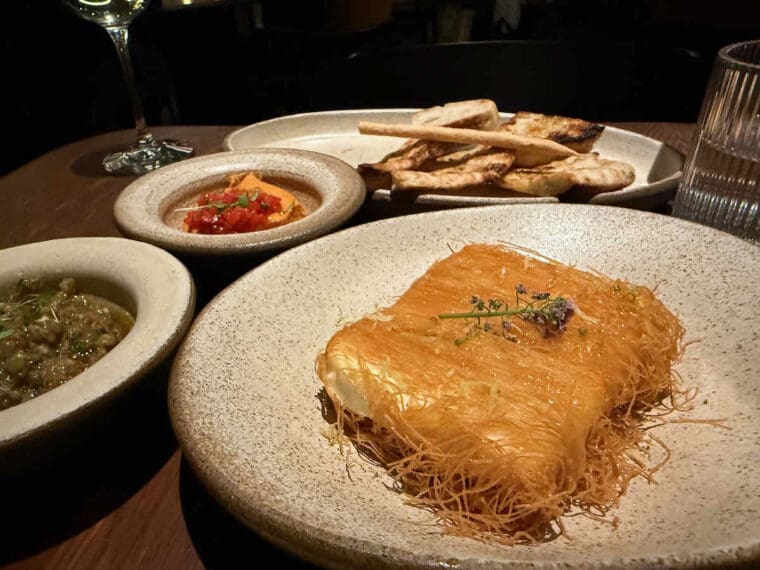 Greek dish Feta Saganaki, cheese fried in shredded filo pastry