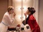 Bette and Joan play photo credit Simon Annand: Greta Scaachi and Felicity Dean facing each other as Bette Davis and Joan Crawford each applying make up in dressing mirror.