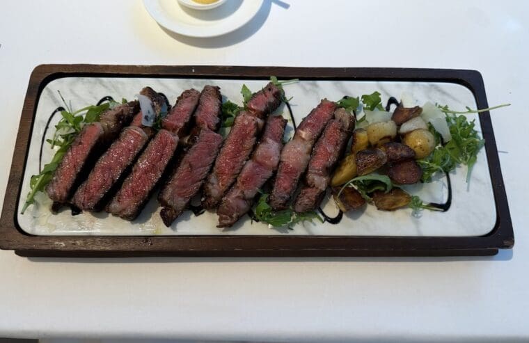 U.S. Ribeye steak with rocket and Modena balsamic vinegar Lucciola