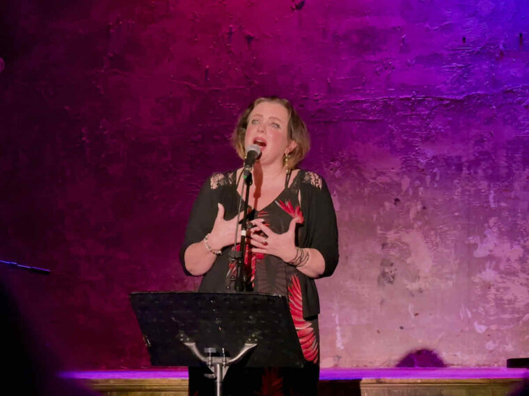 Christine Bovill on stage performing Piaf Revisited at Wilton's Music Hall, East London.