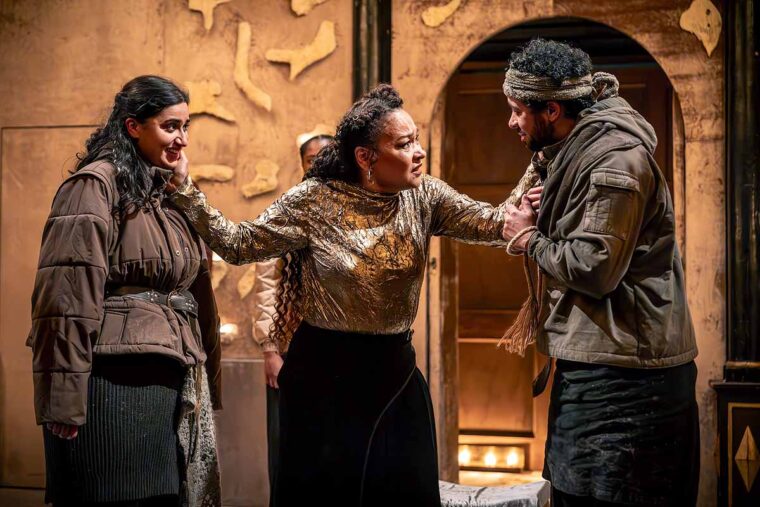Saroja-Lily Ratnavel as Arviraga, Martina Laird as Cymbeline, and Aaron Anthony as Guiderius in Cymbeline (c. Marc Brenner)