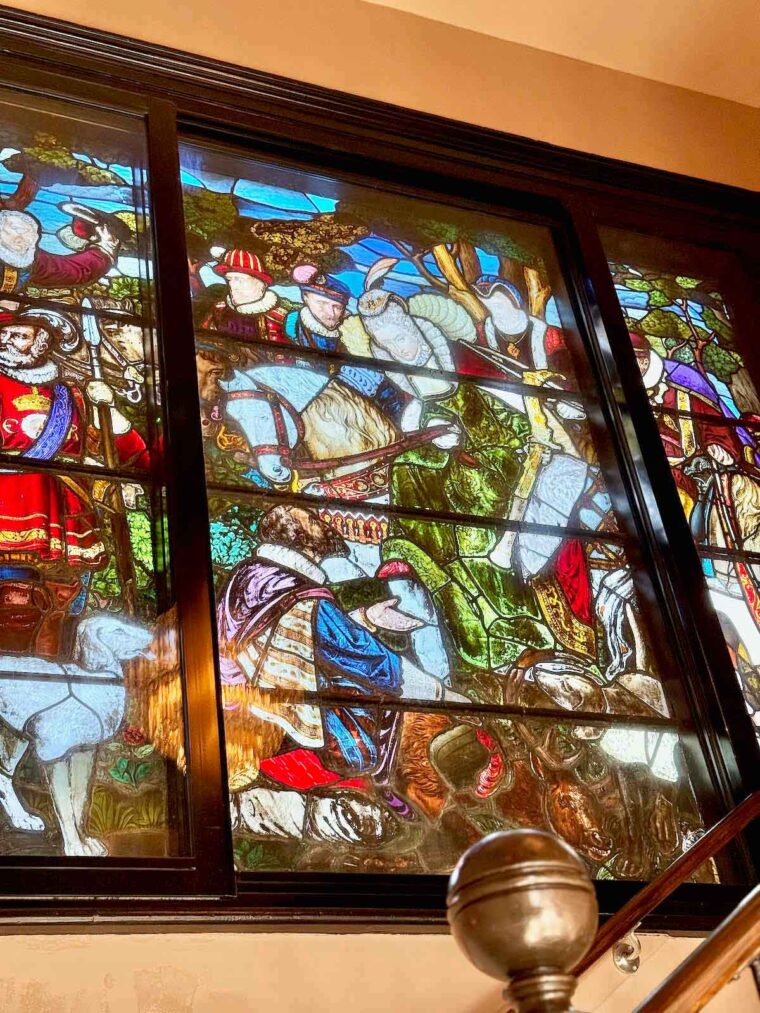 Stained glass window at The Royal Forest hotel, Epping Forest, depicting Queen Elizabeth I upon a horse, learning of Armada defeat.