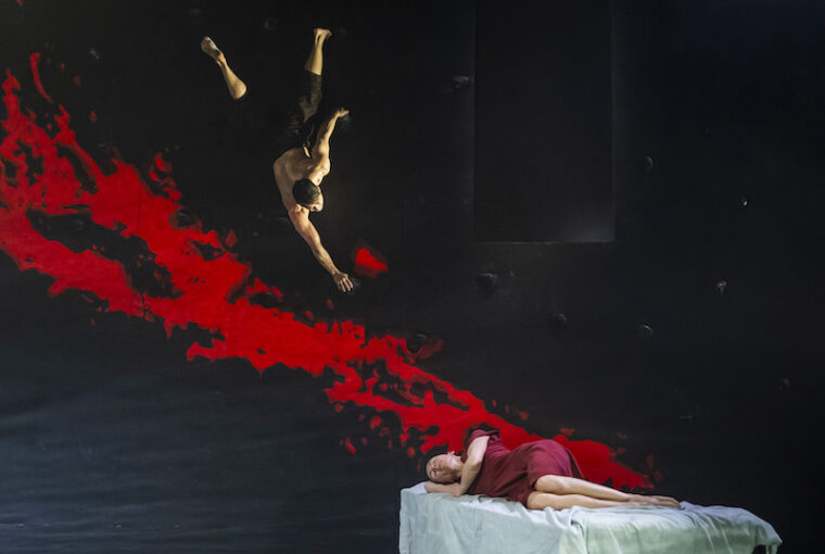 Dionysus hovering over Ariade onstage in the RBO's production of Phaedra + Minotaur
