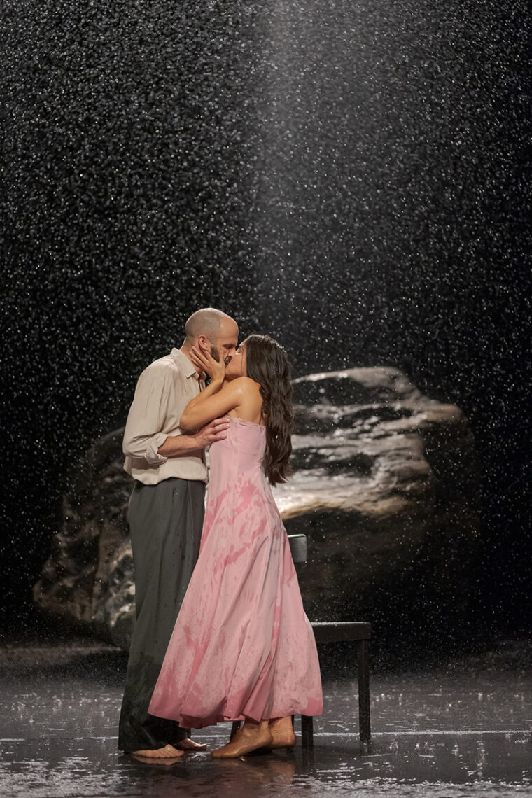 Vollmond - Tanztheater Wuppertal Pina Bausch - couple kissing in the rain - Image credit Martin Argyroglo