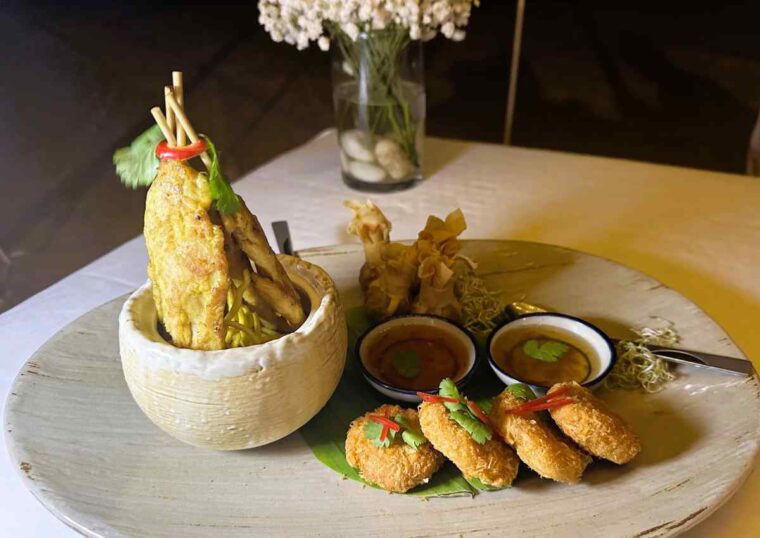 Amari Koh Samui Romantic Dinner starter sharing plate with chicken satay, shrimp cakes, and pork and chicken parcels
