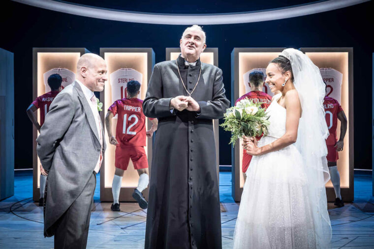 NT Dear England, a groom, vicar and bride capture the mood of the nation. Photo by Marc Brenner.