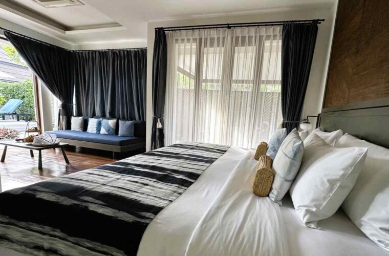 NH Collection Samui Peace Resort one bedroom pool villa bedroom and seating area opens onto the pool terrace