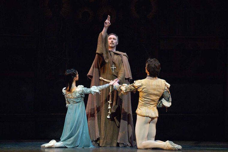 Bennet Gartside as the Friar with Yasmine Naghdi as Juliet and Matthew Ball as Romeo in the 2025 Romeo and Juliet at RBO
