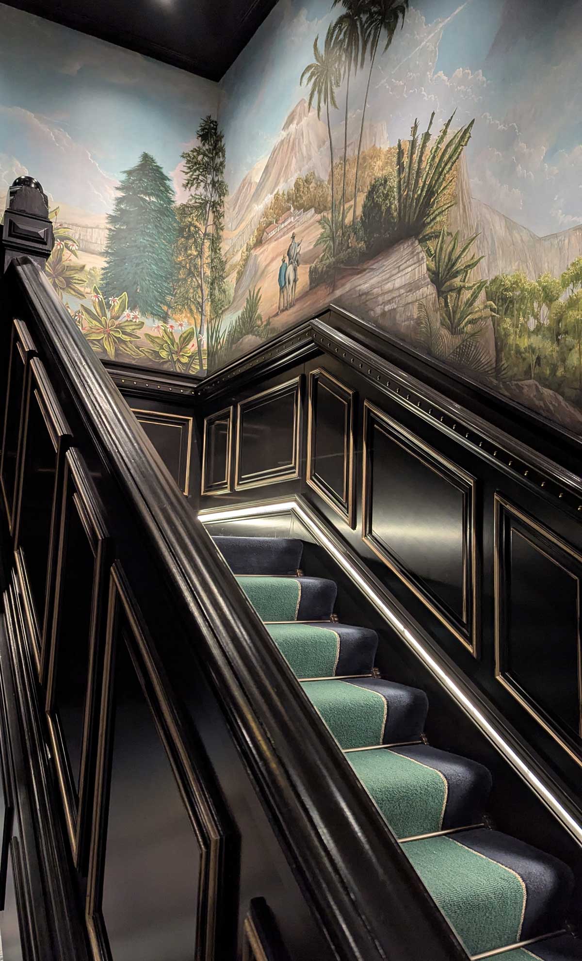 Hand painted mural on the stairs at 100 Princes Street
