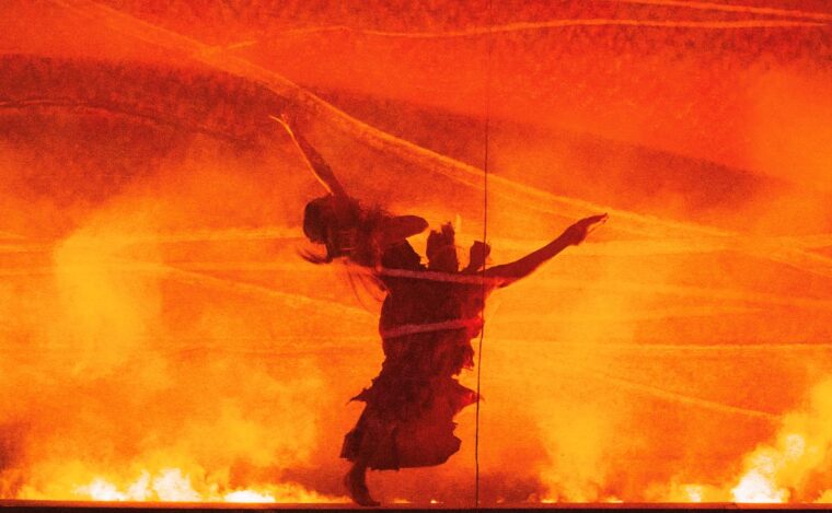 Bertha in a fit of madness among the fire, Credit, Tristram Kenton