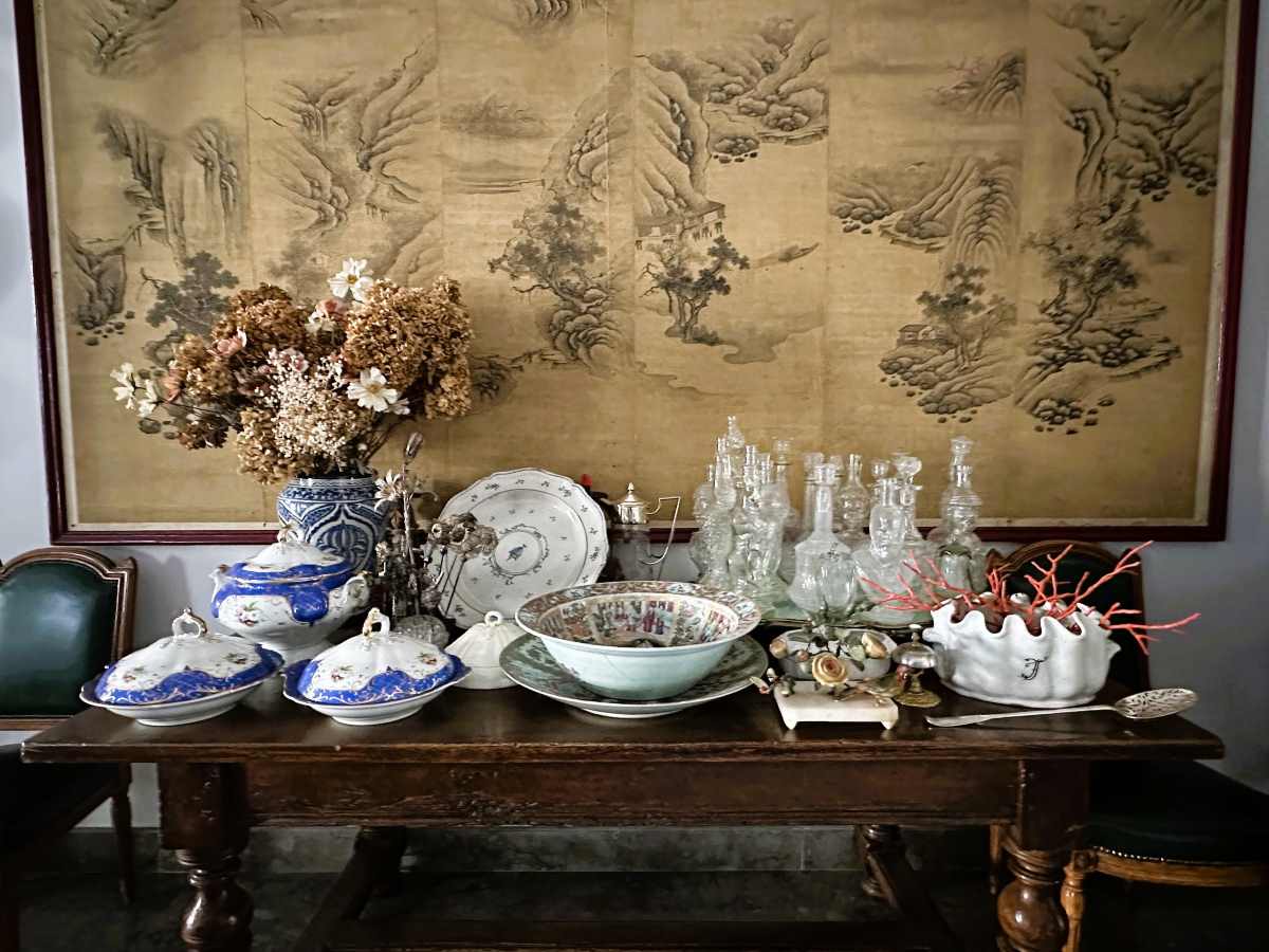 La Bella Palermo is filled with the owner's eclectic collections including crockery and glass bottles in the shape of faces