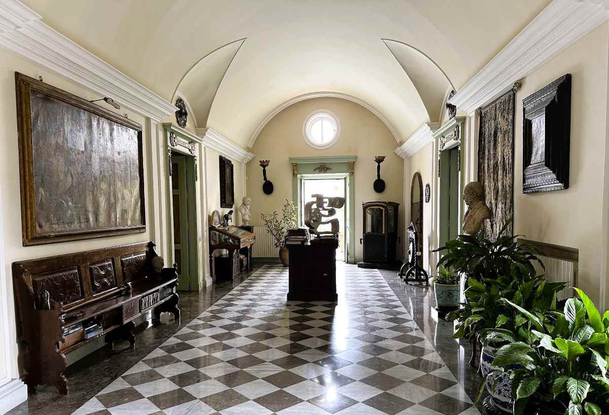 La Bella Palermo has a checkerboard tiled entrance hall filled with antique furnishings