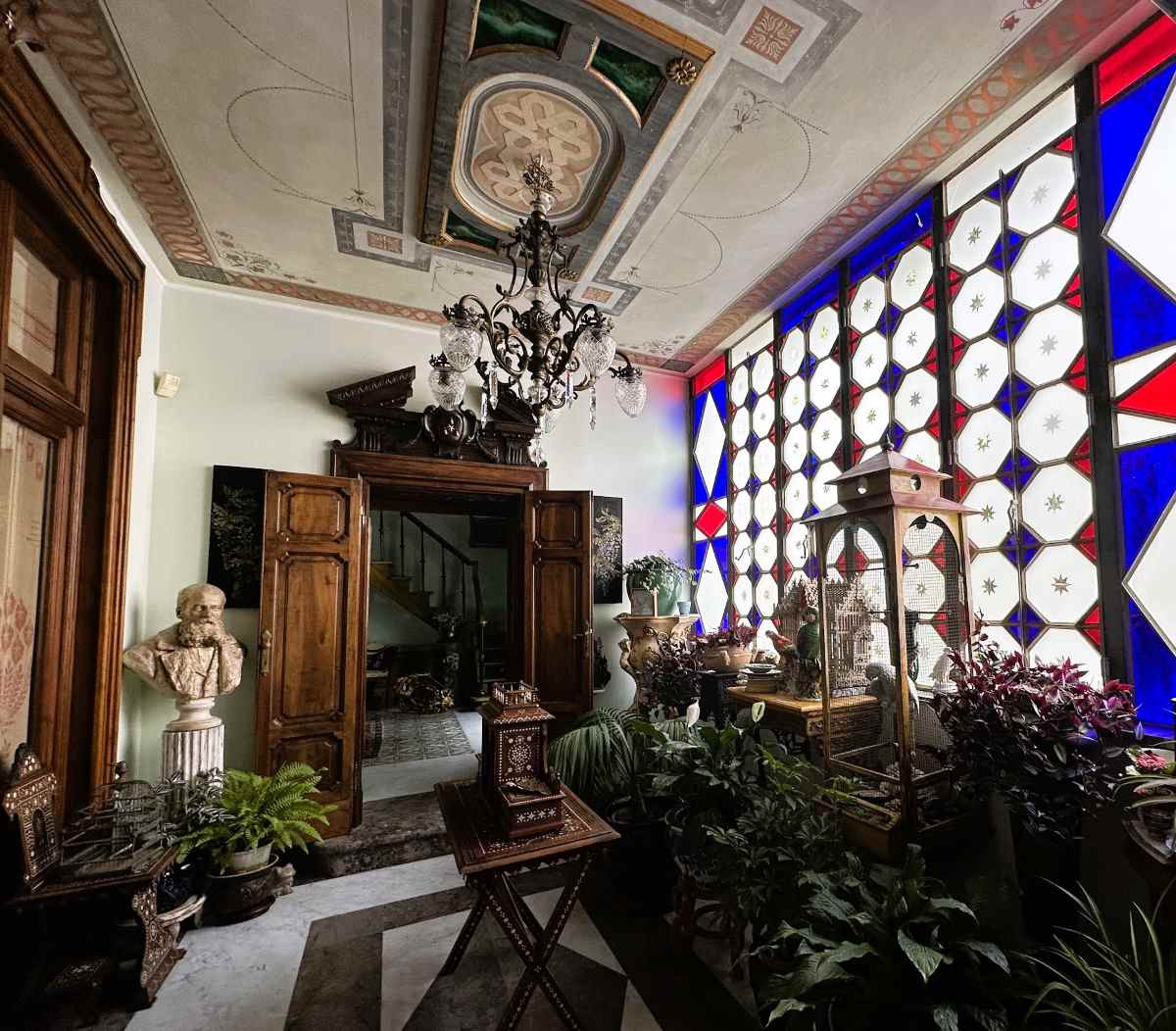 La Bella Palermo has an indoor garden area with stained glass windows and antique bird cages