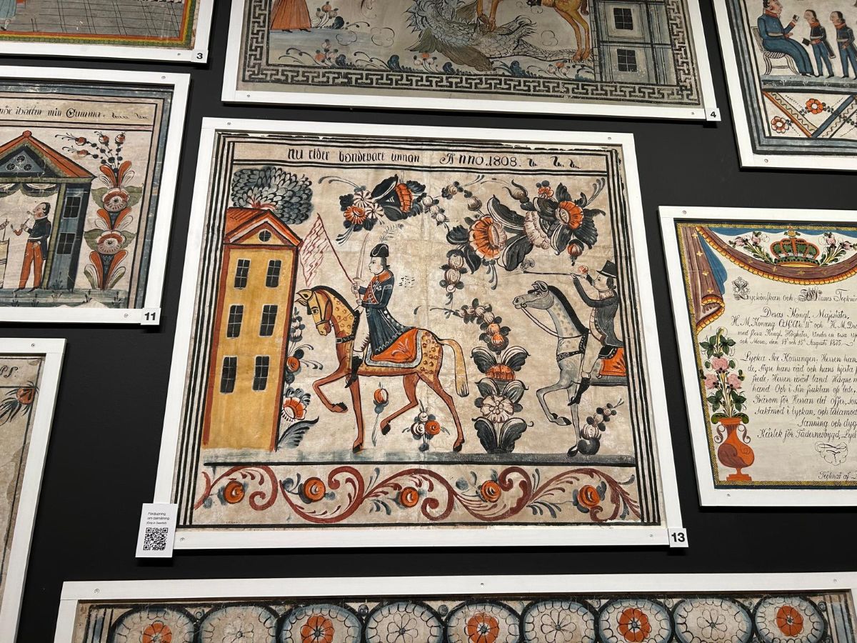 Photograph showing examples of Dalecarlian paintings popular in Sweden in the late 18th and 19th centuries.