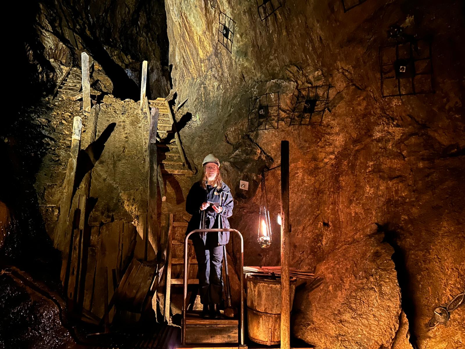 A guide explains the surroundings underground in a copper mine in Falun in Sweden