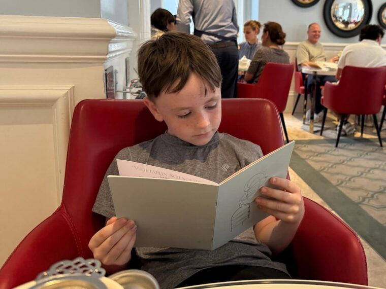 Shay browsing the menu at The Ampersand Hotel 