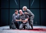 Joel MacCormack as Lucius, John Hodgkinson as Titus Andronicus and Emma Fielding as Marcia Andronicus_credit Genevieve Girling