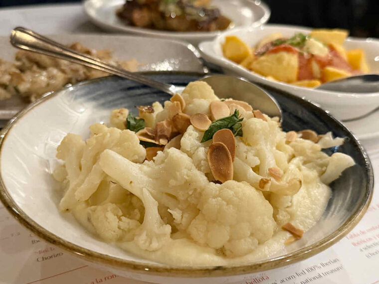 Coliflor asada con Almendras: cauliflower with toasted almonds and mint served at London tapas restaurant El Pirata of Mayfair.