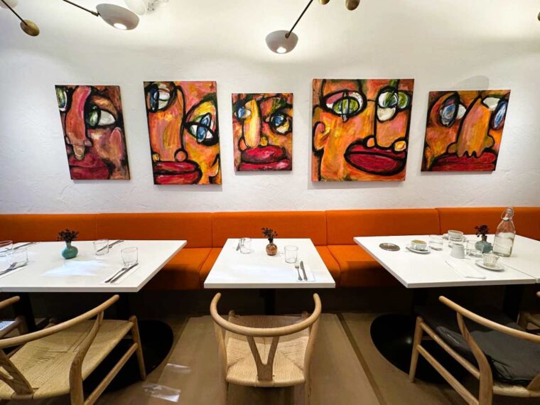 Ottolenghi Hampstead interior is light-filled with orange banquettes and original artworks