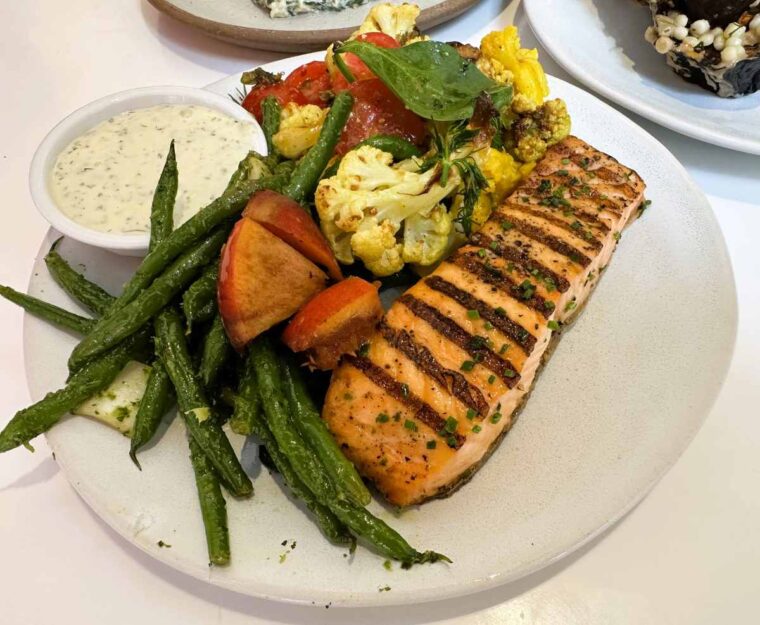 Ottolenghi Hampstead char-grilled Loch Duart salmon with ranch sauce and a selection of salads