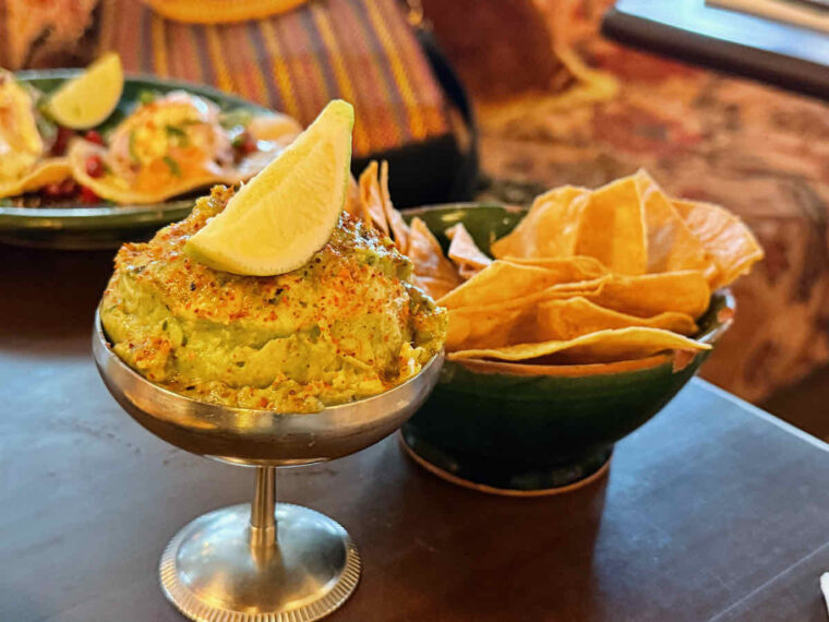 Tigermilk appetiser of guacamole and tortilla chips
