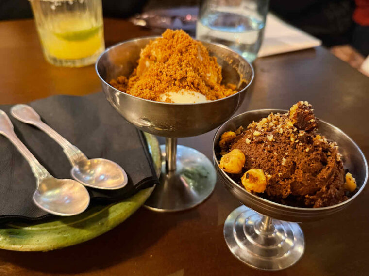 Desserts served at Tigermilk restaurant, London: Dulce di latte ice cream and chocolate Mousschachado in silver stemmed dishes.