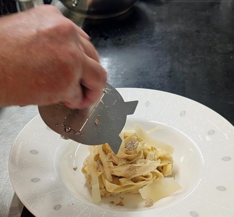 Shaving white truffle onto Taglioni at the Lansdowne Club
