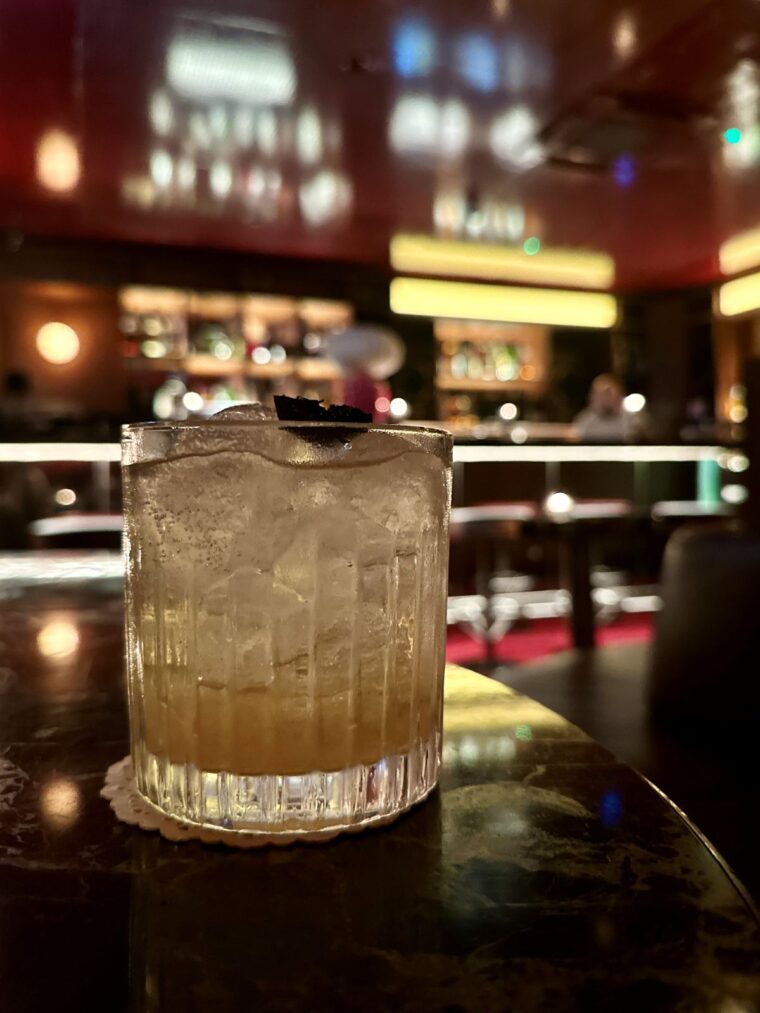 Mezcal Spritz - made with Illegal Mezcal, Black Lime Cordial and Soda at London Mayfair's Bar Encore