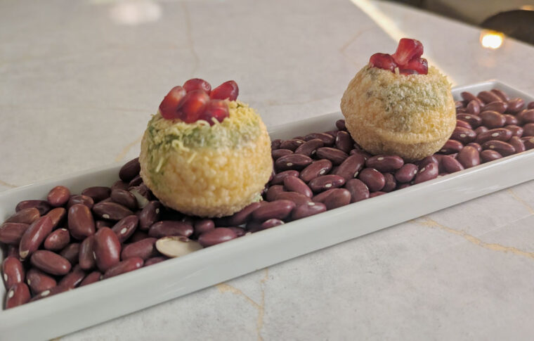 Image of two small bite dahi sev puri at Cho Asia restaurant.