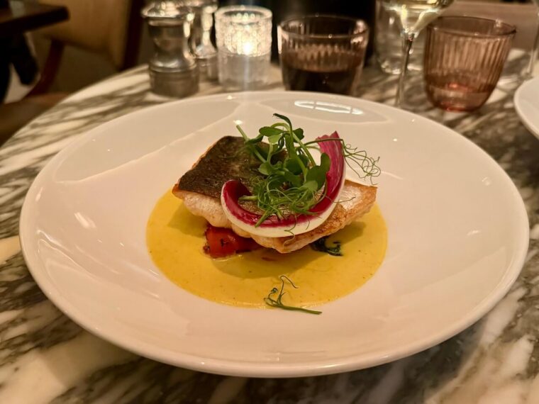 Pan fried salmon in a curry beurre blanc