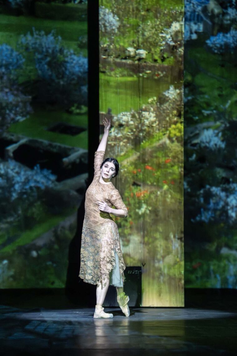 Natalia Osipova as Virginia Woolf in Wayne McGregor's I Now, I Then in Woolf Works against a backdrop of English countryside