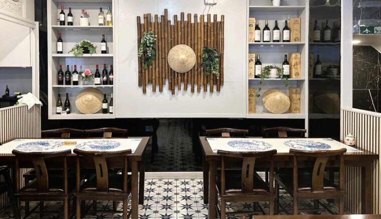 Cafe East interior decoration with bamboo and Vietnamese hats