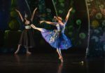 Dressed for the ball, Cinderella dances in the forest