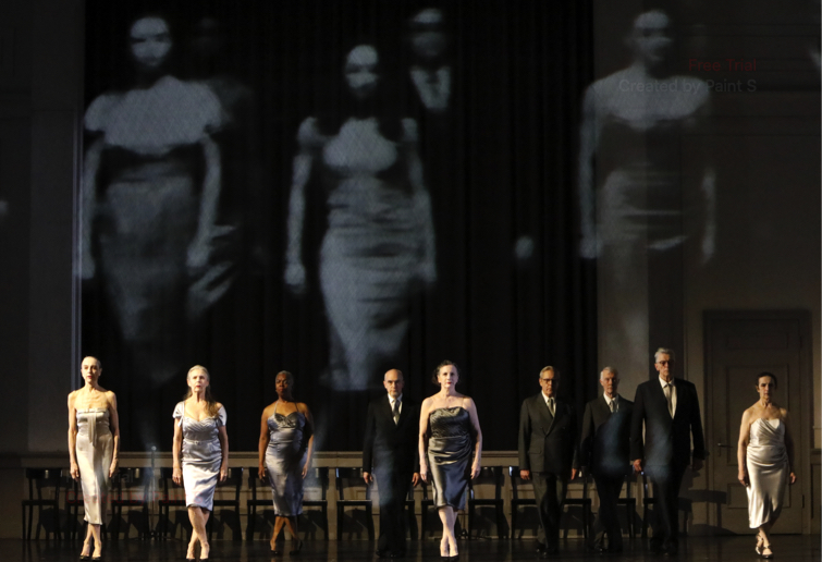 Nine dancers, the women in satin evening gowns and stilettos, the men in black suits and ties, walk towards the audience, set against black and white film of their younger selves in Kontakthof