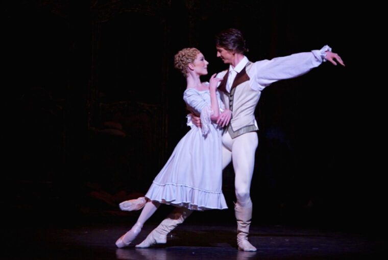 In the bedroom pas de deux, Manon leans against her lover, Des Grieux. They look each other in the eyes