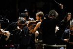 If someone asked you what to expect from a programme called 20th-Century Classics, what would you pick? I’d definitely include some Stravinsky, with The Rite of Spring the obvious choice. How about a bit of Shostakovich, or Messiaen’s Turangalîla-Symphonie? For something a little more playful, perhaps Bernstein’s Symphonic Dances from West Side Story. Bartók’s Concerto for Orchestra would be another obvious contender. But what about the Second Viennese School? Maybe Berg’s Three Pieces for Orchestra or Schoenberg’s Five Pieces for Orchestra. And, of course, there is so much more. Classical music evolved extraordinarily quickly during the 20th century, branching out in radically different directions and challenging almost every convention along the way. Whoever programmed Monday’s 20th-Century Classics Prom created a phenomenal showcase for that night’s orchestra: the combined forces of the Juilliard Orchestra and the Royal Academy of Music Symphony Orchestra, conducted by Esa-Pekka Salonen and joined by violinist Vilde Frang. Perhaps the music was deliberately chosen to allow these brilliant young players to have their moment. In Igor Stravinsky’s Symphony in Three Movements, there was some wonderful playing from Dohyun Lee at the piano, complementing the vigorous, rhythmically precise strings led by Katya Moeller. Next came Berg’s Violin Concerto, with the young Norwegian violinist Vilde Frang as soloist. In a delicate and sensitive performance, she engaged brilliantly with the orchestra, turning to play in dialogue with each section as appropriate. The highlight of the evening for me, though, was Bartók’s Concerto for Orchestra. It is a powerful work that illustrated the immaculate ensemble playing of this specially assembled group. Shimmering upper strings in the first movement interrupted the powerful cello and viola opening, with compelling, declamatory brass weaving through the music. The second movement saw pairs of instruments creating a mosaic of sounds. The poignant slow movement led into the Interrupted Intermezzo, full of pastiche and humour. The Finale is a brilliant dance: a whirlwind of sound displaying the virtuosity of these exceptional young players. A joyful, fast-and-furious performance of the Galop from Stravinsky’s Suite No. 2, played by the whole orchestra, brought the evening to a close. We drifted out into the summer warmth of London feeling optimistic about the future of classical music, as represented by this talented young ensemble. Listen to Esa-Pekka Salonen conducting Stravinsky, Berg and Bartók on BBC Sounds.